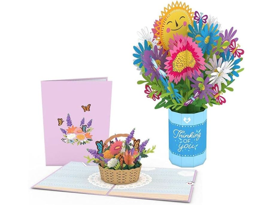 A pop up card bundle of flower bouquets and flowers in a basket