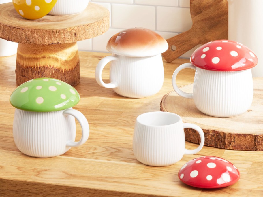 mushroom top coffee mugs on wood counter