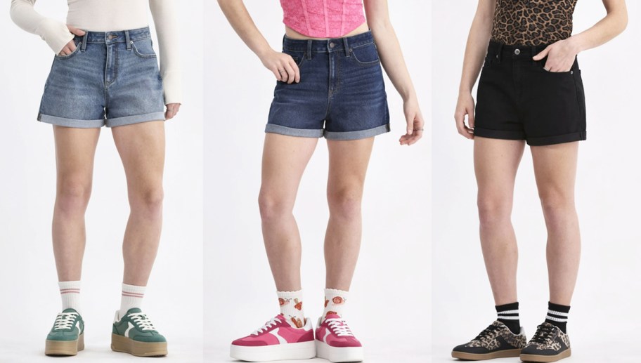 three women modeling shorts in different washes