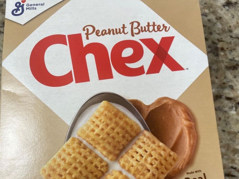 Peanut butter chex cereal on top of the table