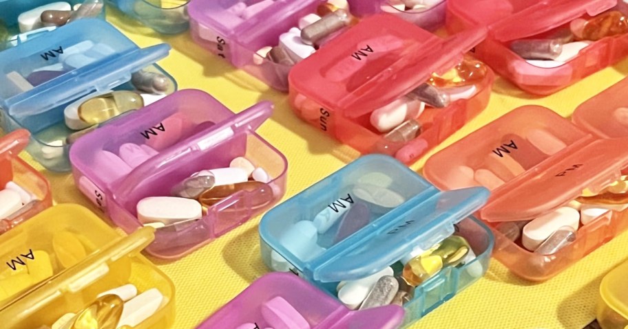 colorful pill AM/PM organizers filled with pills