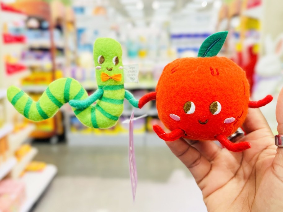 hand holding up Apple and Worm Felt Duo Easter Figurine
