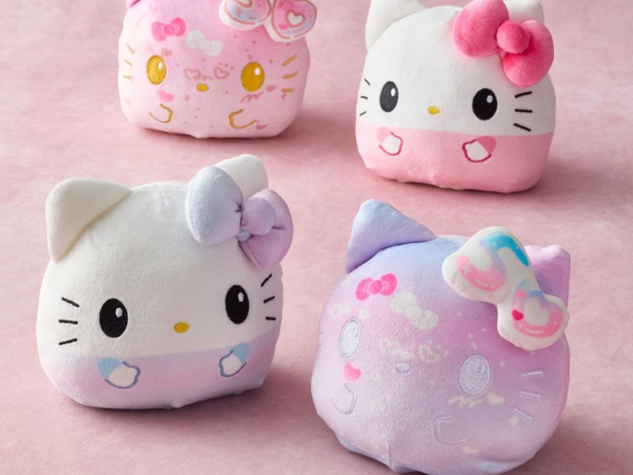 4 Hello Kitty 50th Anniversary plushies in pink and purple