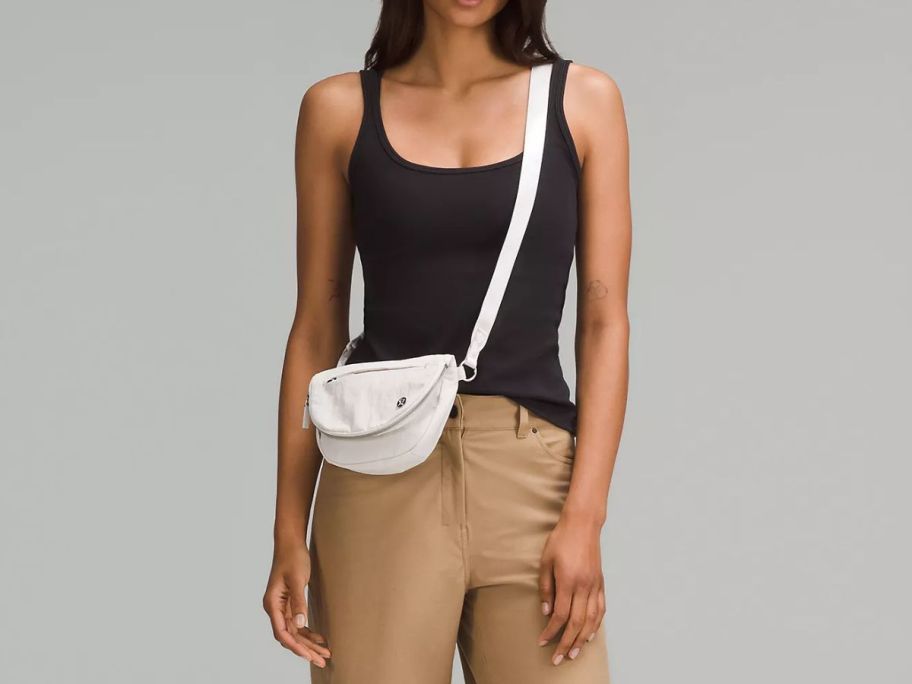 Woman wearing lululemon All Night Festival Bag Micro 2L