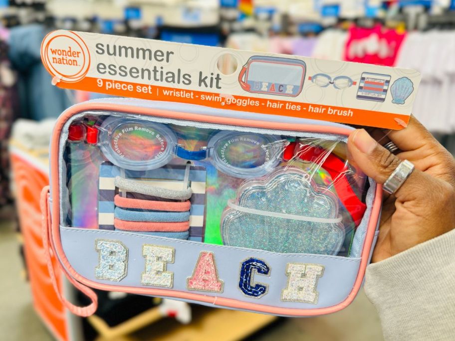 Hand holding a Wonder Nation Summer Essentials Kit with BEACH logo