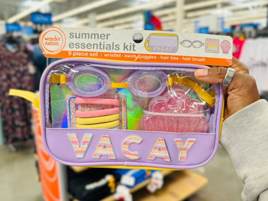 Hand holding a Wonder Nation Summer Essentials Kit with VACAY logo
