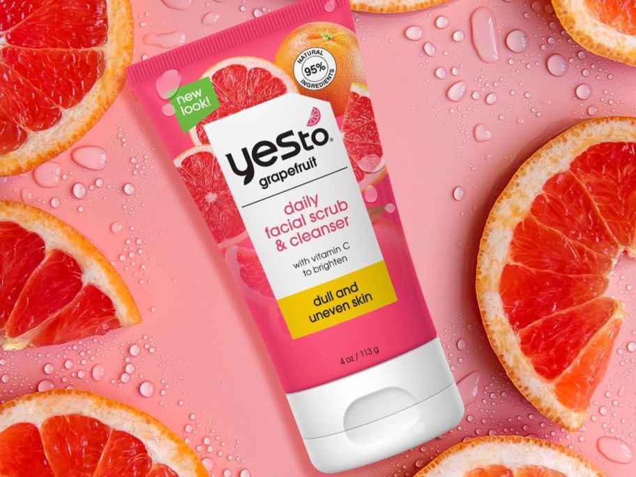 A tube of grapefruit cleanser amidst grapefruits 