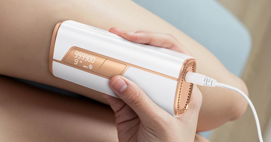 laser hair remover being used on legs