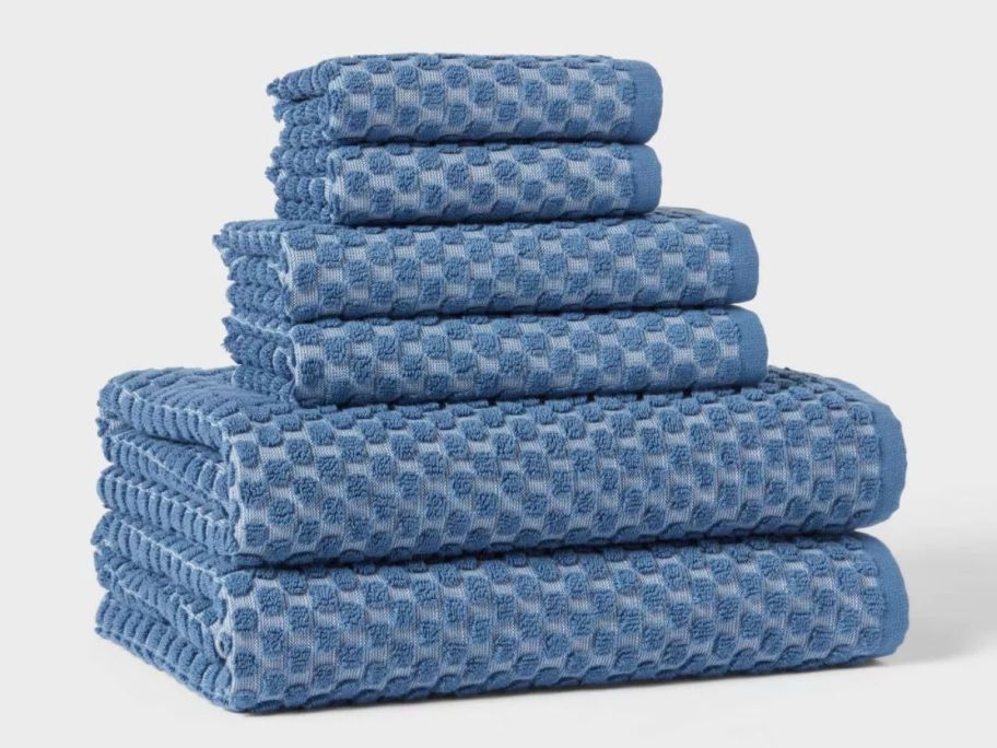 blue dotted Threshold 6-Piece Performance Plus Textured Dot Bath Towel Set stacked on top of each other