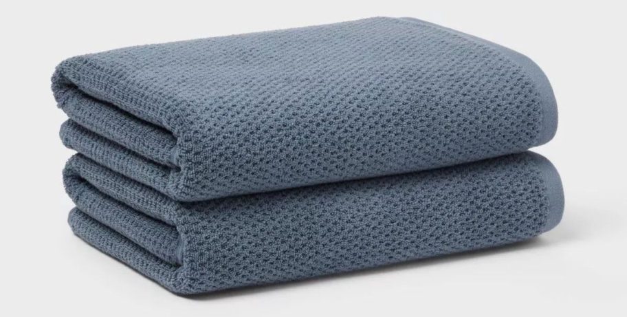 two greyish blue Threshold Luxe Textured Dot Towels stacked on top of each other