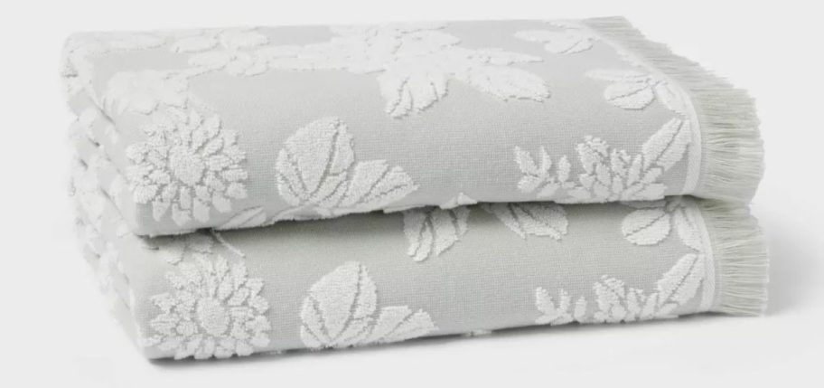 two light grey Threshold Traditional Garden Floral Towels stacked on top of each other