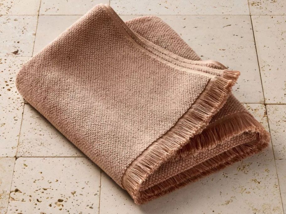 light brown Casaluna Organic Texture Bath Towel on tiled floor