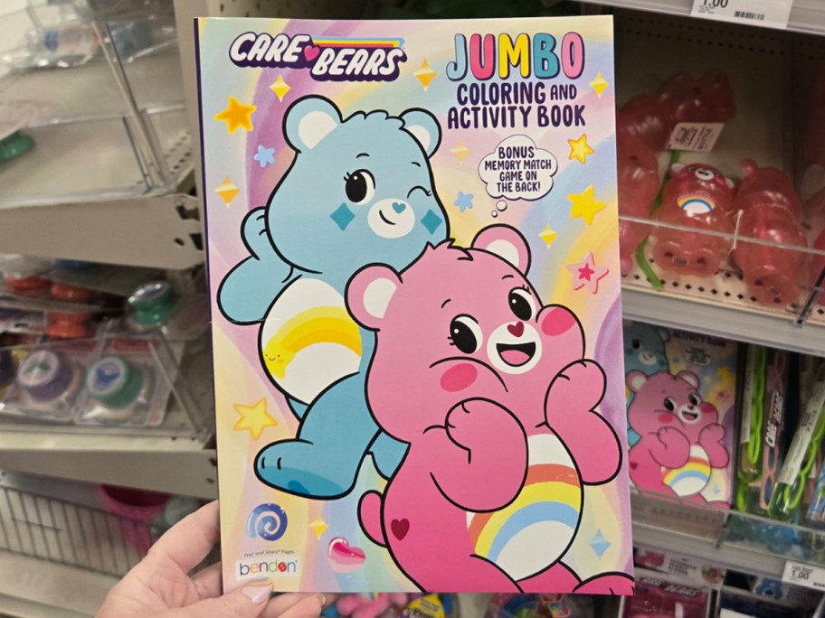 hand holding Care Bears coloring book 
