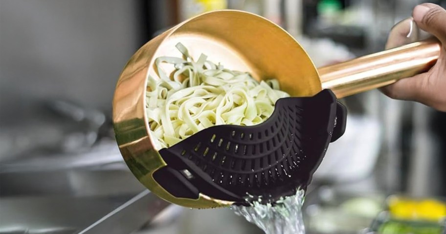 clip on strainer on a pot with noodles