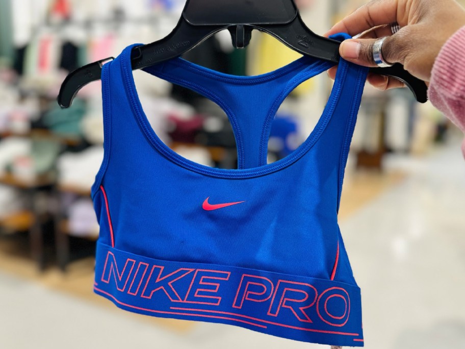 hand holding blue nike bra