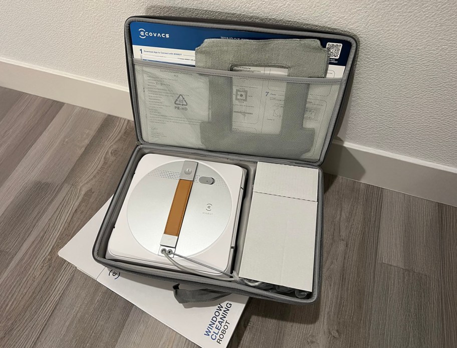 ecovacs winbot in a carrying case