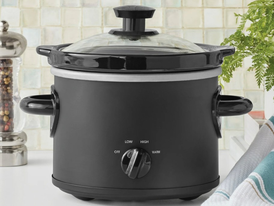black slow cooker on table
