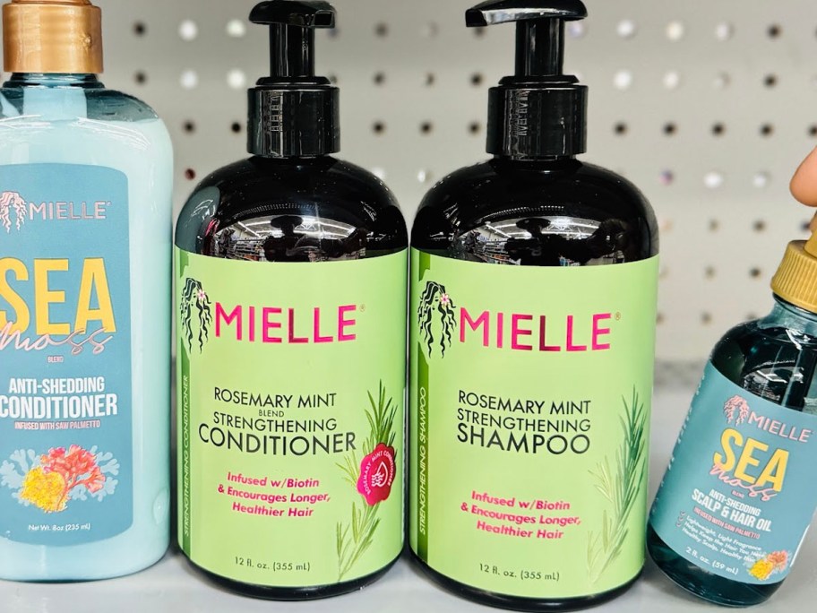 bottles of mielle shampoo and conditioner on shelf