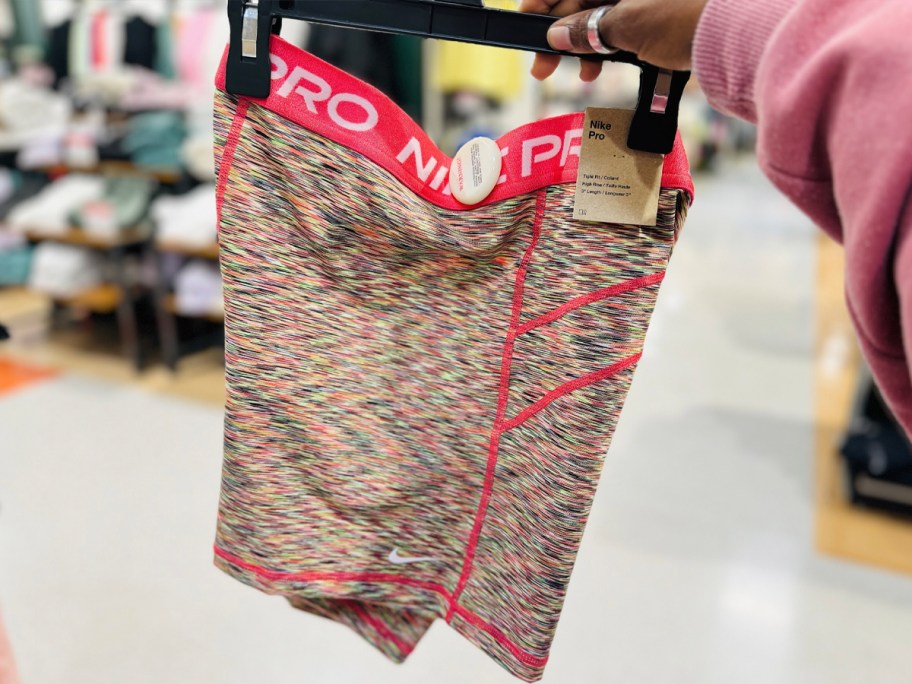 hand holding pink pro shorts