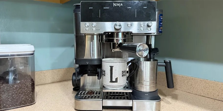 ninja coffe maker on counter with coffee mug