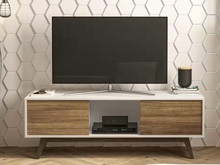 brown and white tv stand with tv on top