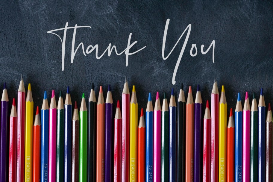 many pencils in a row on chalkboard with thank you letters