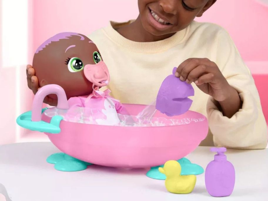 girl playing with Cry Babies Newborn My First Bath Set