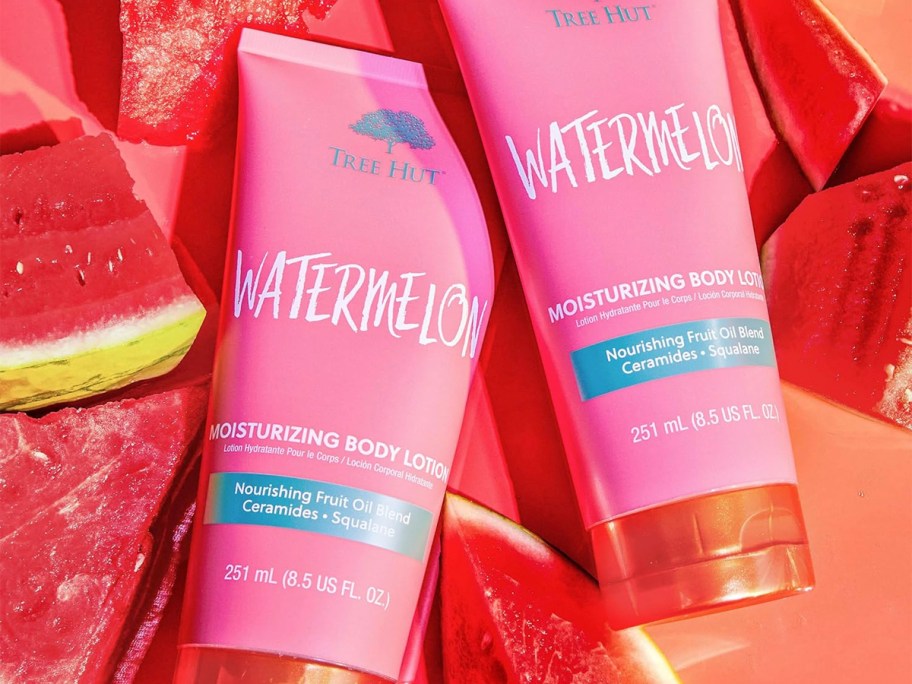 two bottles of tree hut body lotion