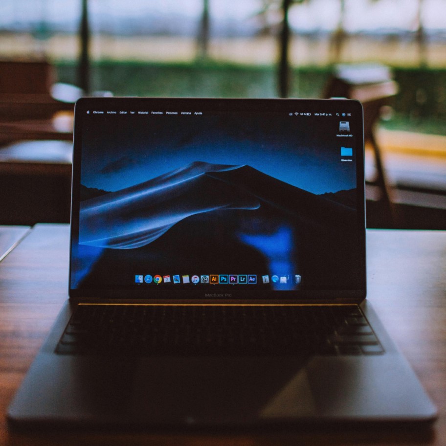 mountains on laptop facing outdoor window