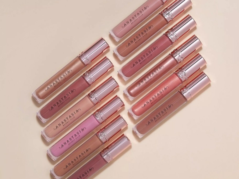 12 tubes of lip gloss in various shades