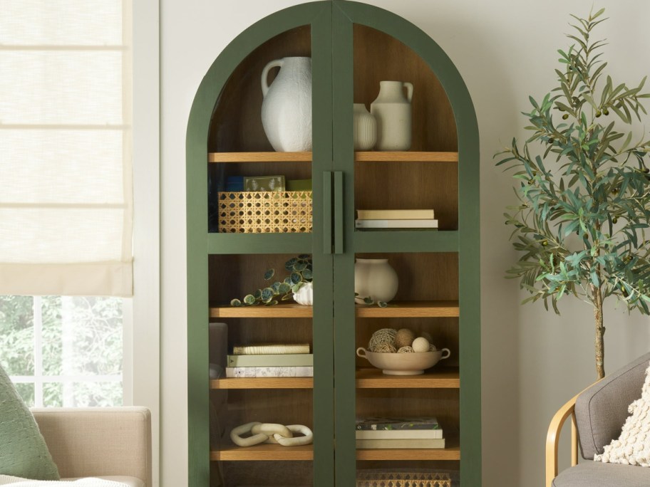 Better Homes & Gardens Juliet Wood Frame Arc Cabinet displayed on a wall