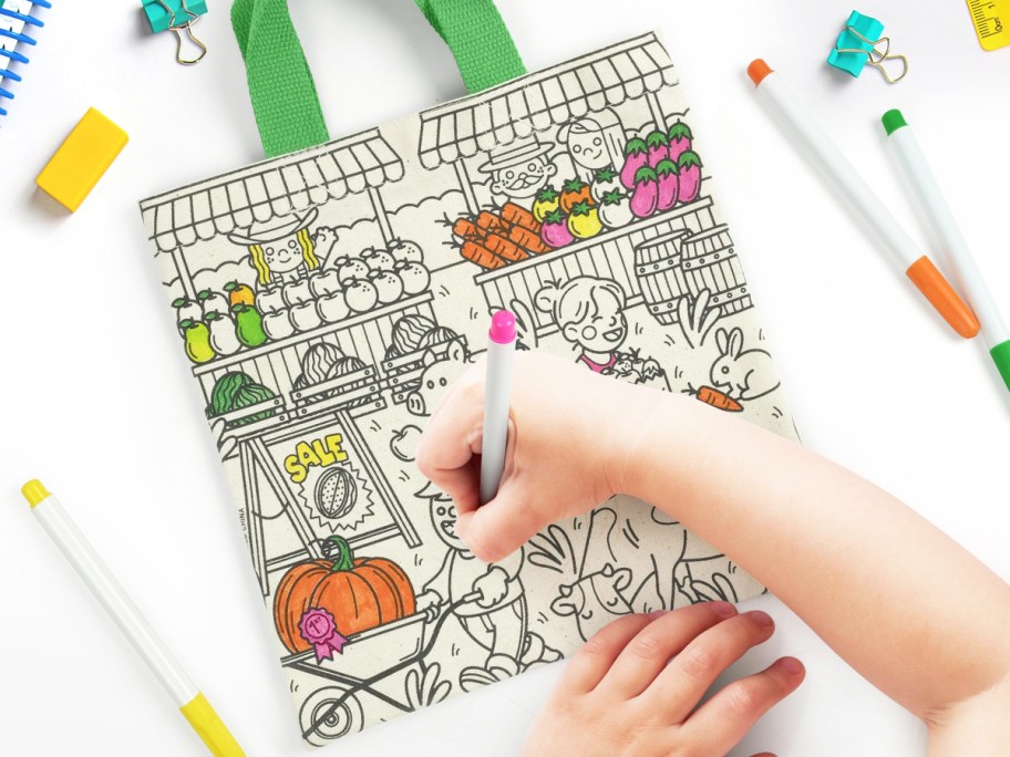 coloring a tote bag with markers
