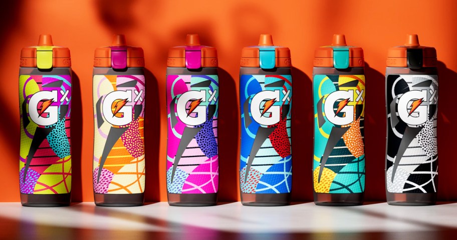 6 patterned gatorade water bottles in a row