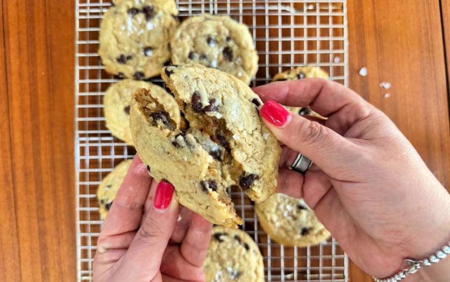 breaking a sourdough chocolate chip cookie in half 
