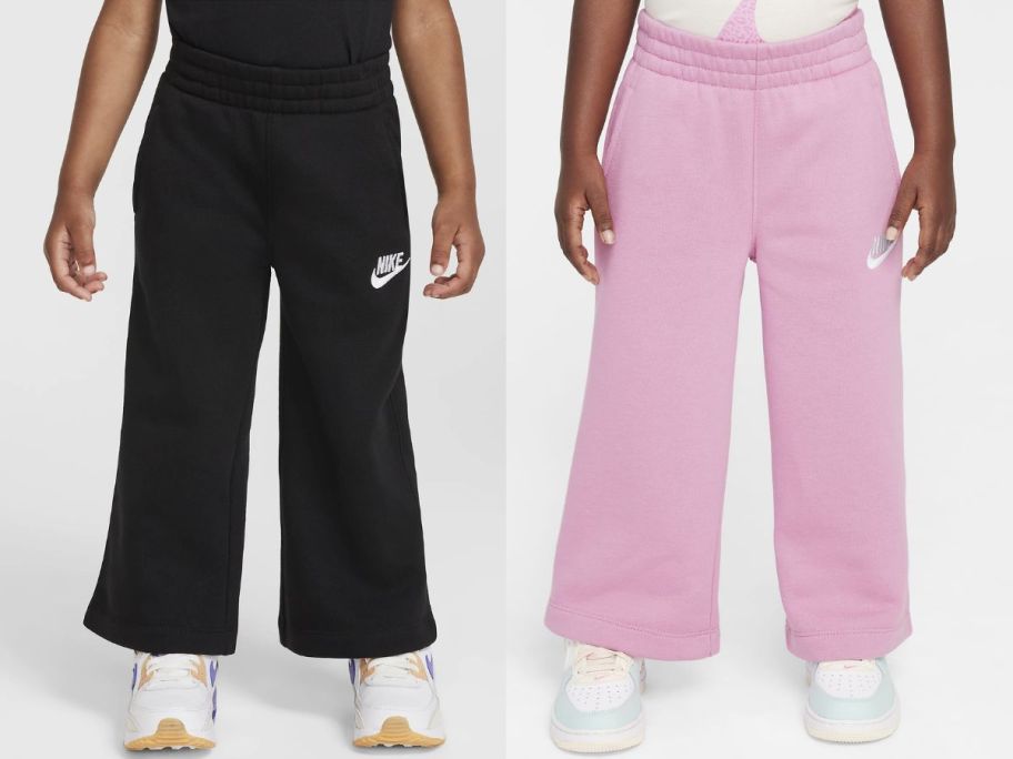 toddlers wearing black and pink fleece joggers 