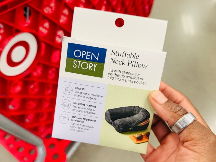 Hand holding an Oen Story Packable Neck Pillow