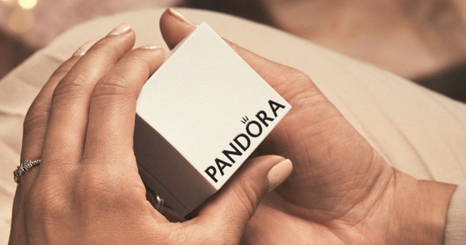 Woman's Hands Opening a Pandora Gift Box