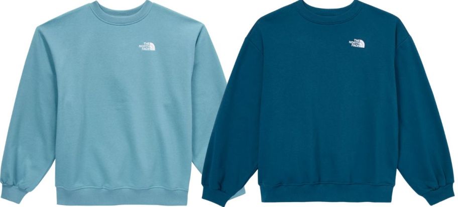 two womens north face oversized sweatshirts stock images