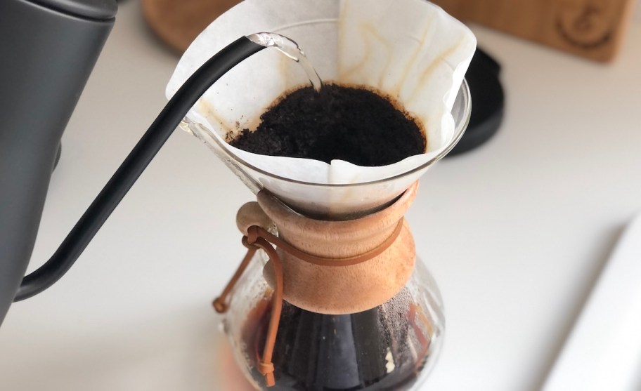close up of brewing coffee with chemex glass coffee maker