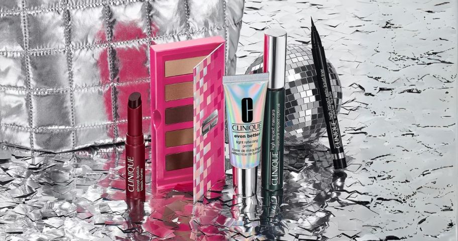 clinique products and bag on silver sparkles