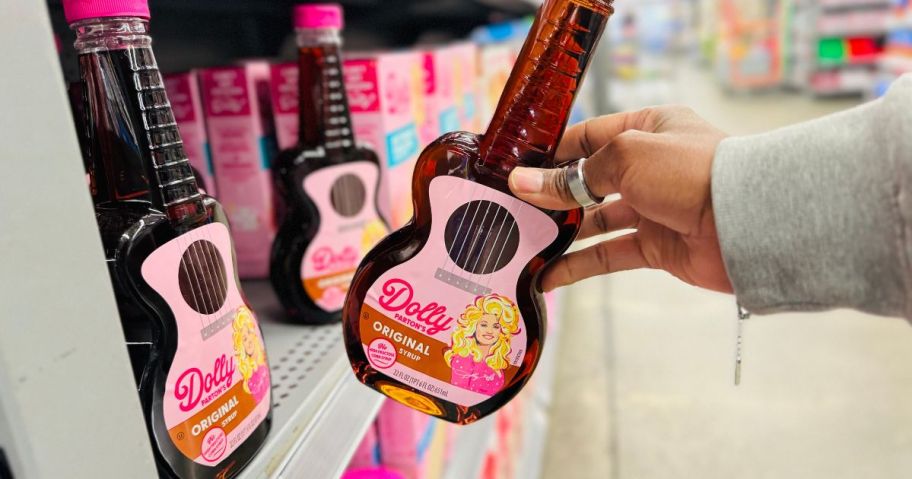 Dolly Parton's Original Syrup 22oz Bottle in hand in store