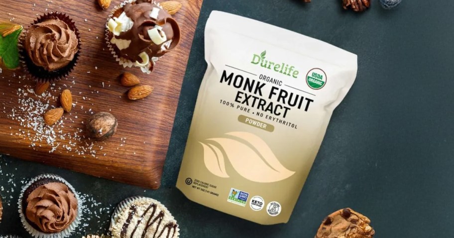 bag of monkfruit on a table with brownies and cookies with a cutting board