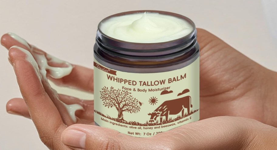 hand-holding-whipped-tallow-balm-in-7oz-Jar.