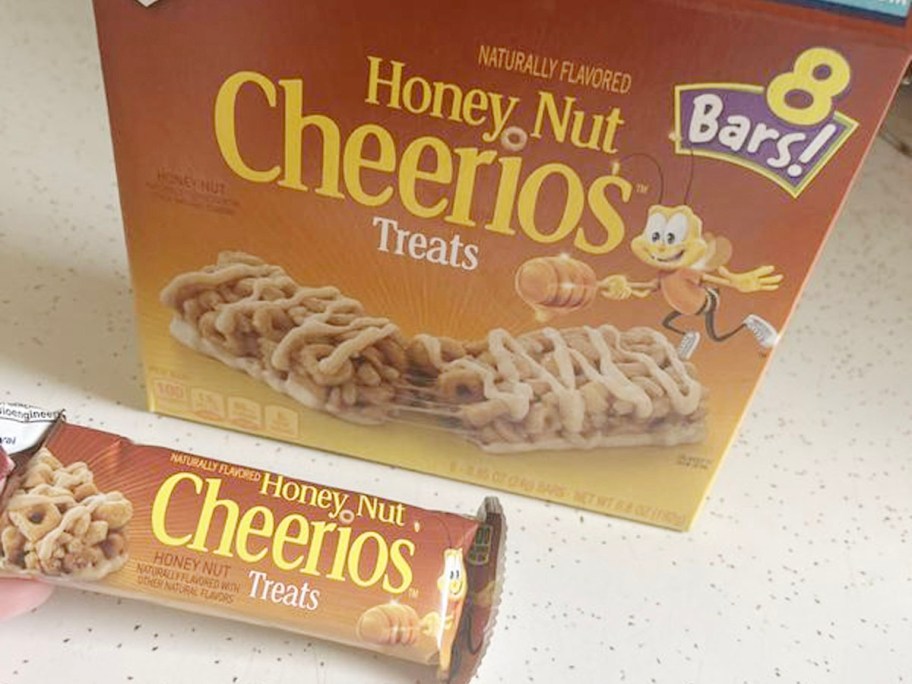 honey nut cheerios bars box with bar in front of it on table