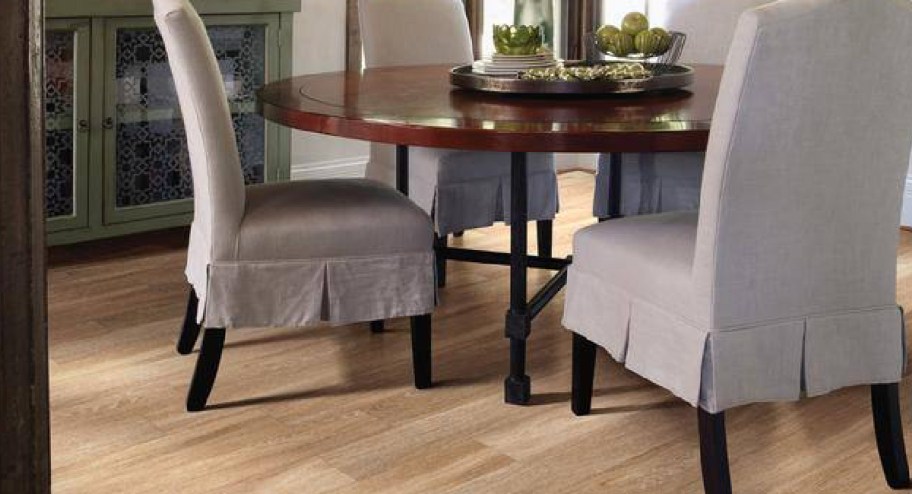 light beige flooring with dining table on top