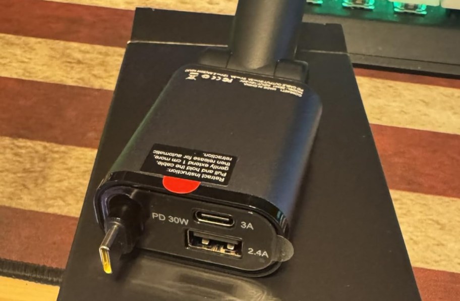 retractable car charger sitting on table