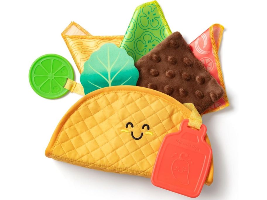 Melissa & Doug Multi-Sensory Soft Taco Fill & Spill Infant Toy stock image
