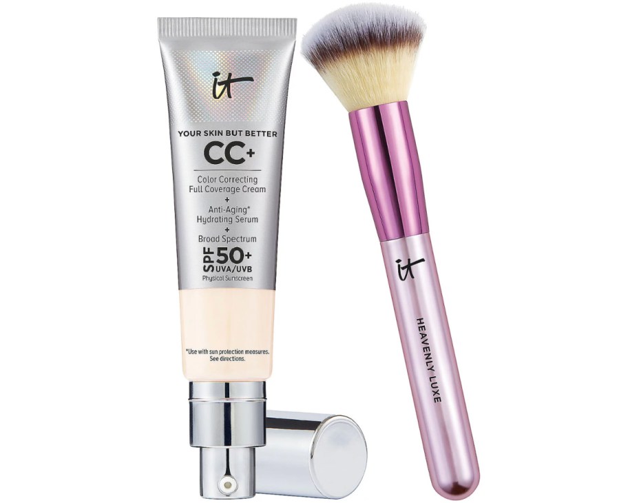 tube of concealer and pink makeup brush
