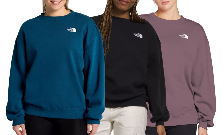 3 women wearing north face sweatshirts