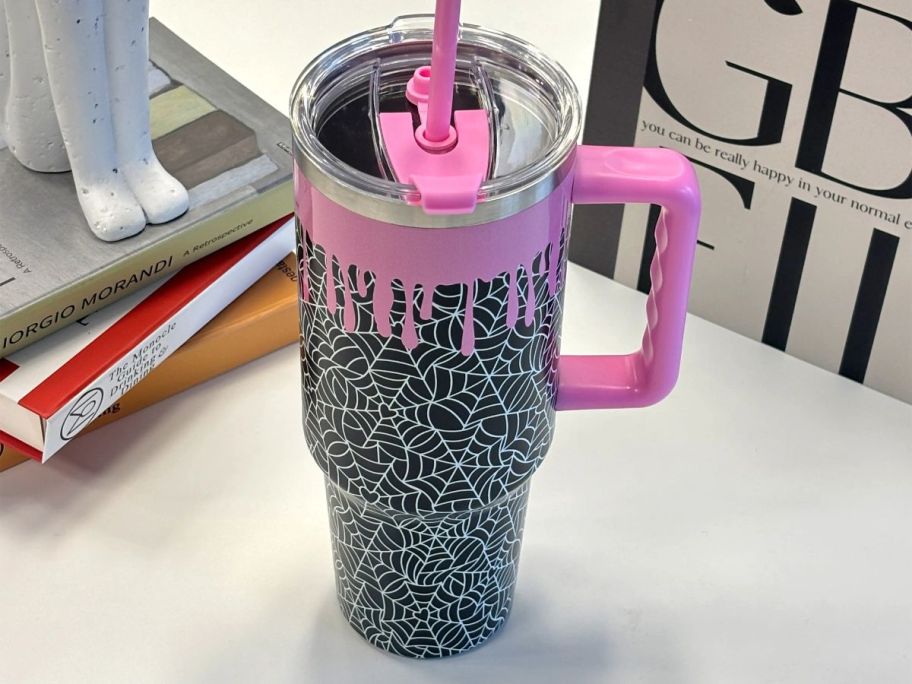 pink and black Ashland 40oz Spider Web Stainless Steel Insulated Tumbler on desk